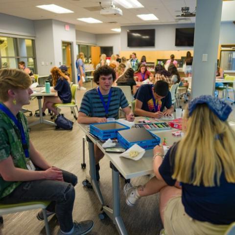 Students speaking around a table