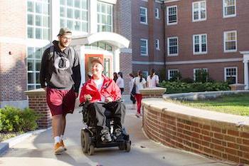 student in wheelchair on Congreve ramp