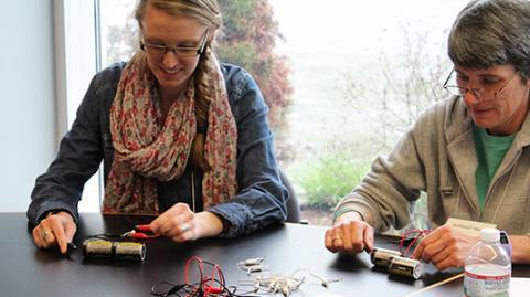 Educators working on a project at summit