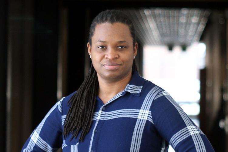 Portrait of Black woman in blue plaid shirt